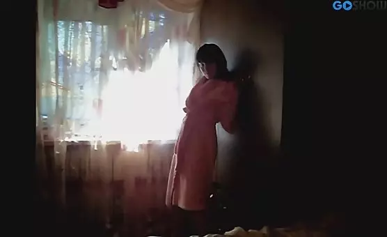 Brunette Flirts in a Bathrobe, Revealing Charms